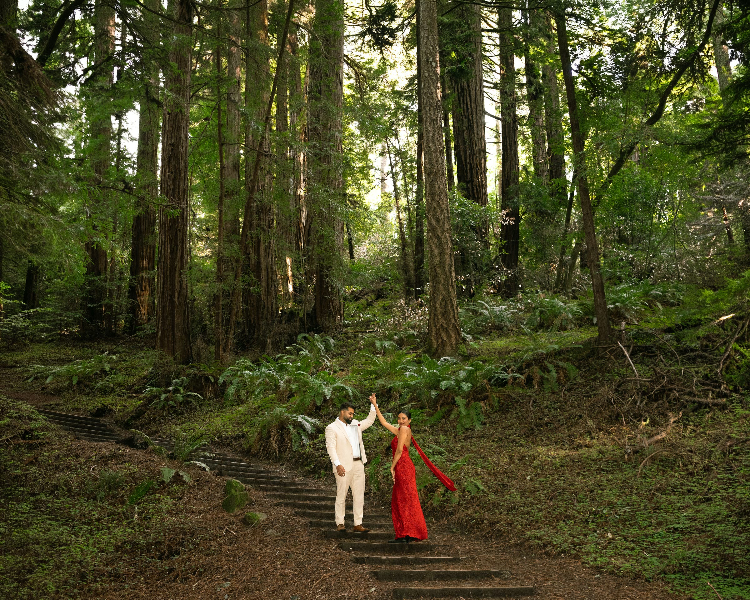 Nish and Pooja on a forest staircase